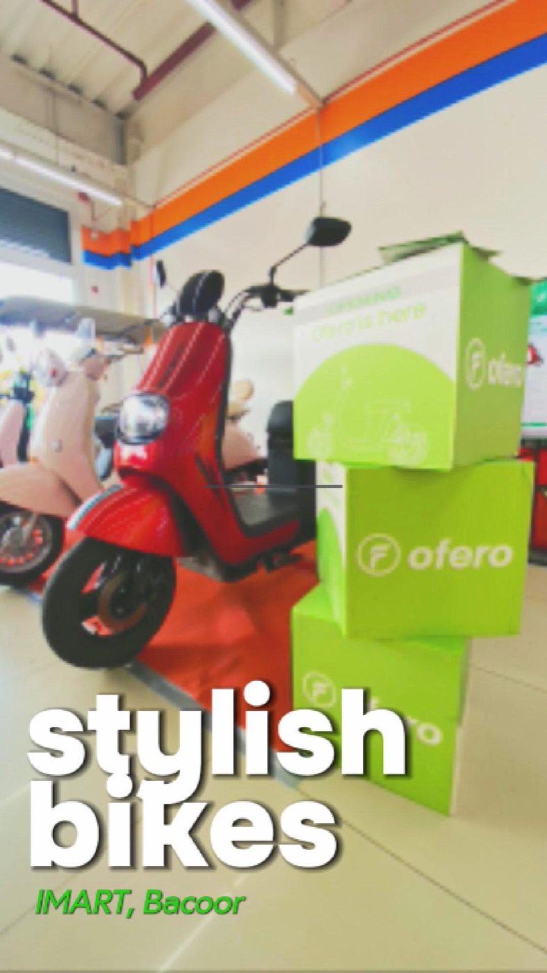 Ofero Bacoor iMart sales booth photo with red electric bike and Ofero display